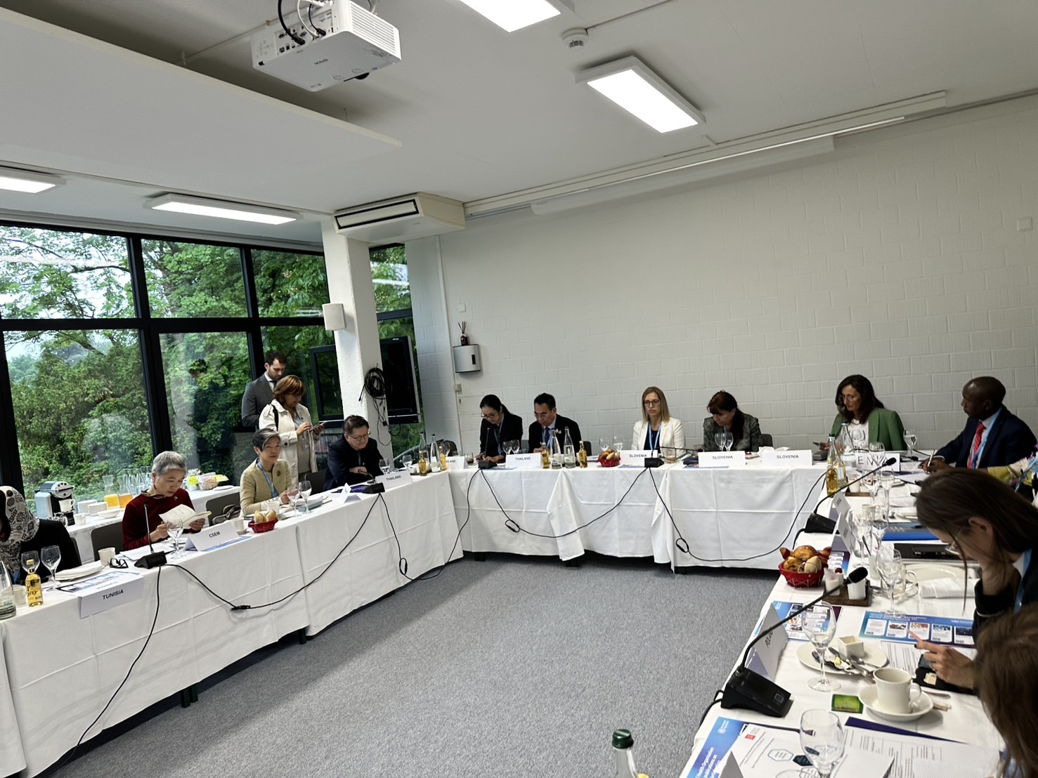 A group of people sitting at long tablesAI-generated content may be incorrect.